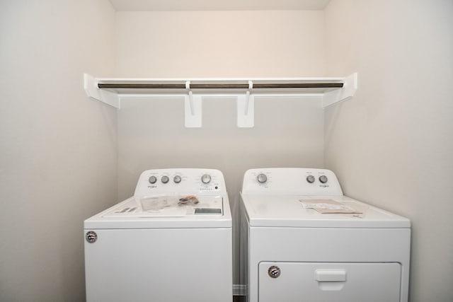 laundry room with washing machine and clothes dryer