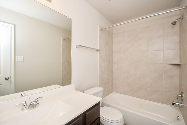 full bathroom featuring vanity, toilet, and tiled shower / bath