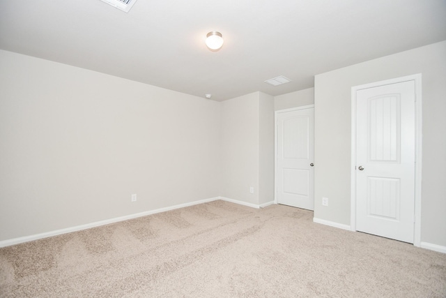 empty room featuring carpet flooring