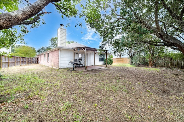 rear view of house featuring a patio