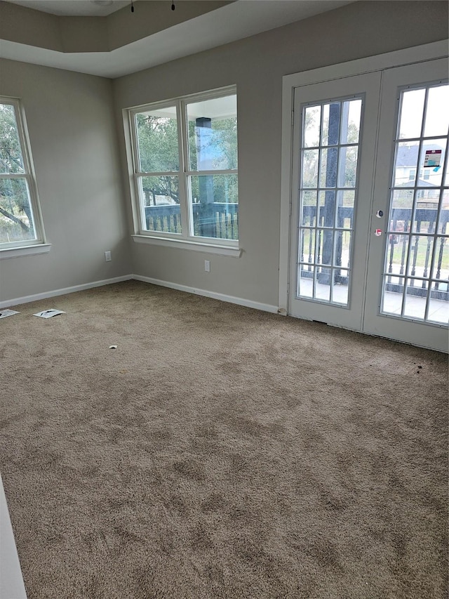 9736 Kerr St, Houston, TX 77029 - empty room featuring healthy amount of natural light and carpet