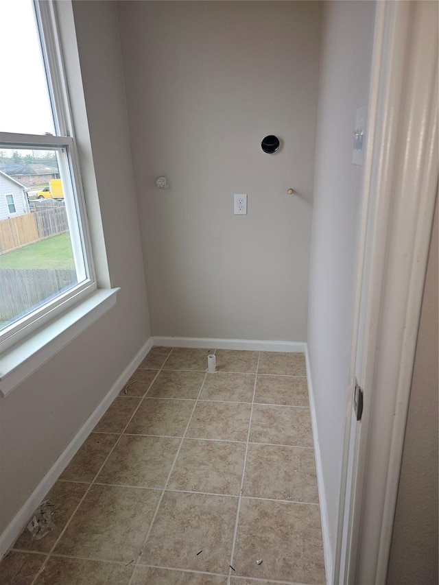 washroom with light tile patterned floors