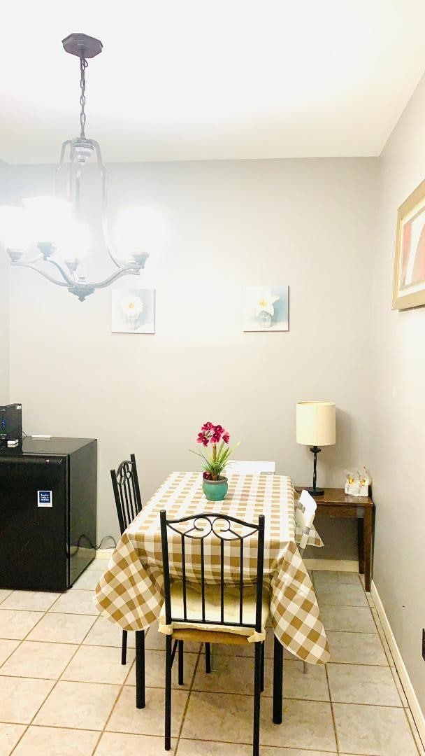 dining room featuring light tile patterned flooring