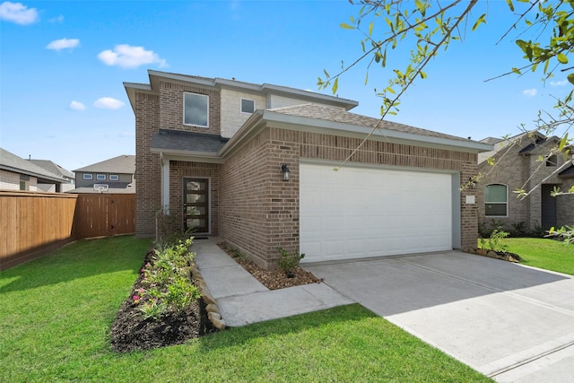 view of front of property featuring a garage and a front lawn