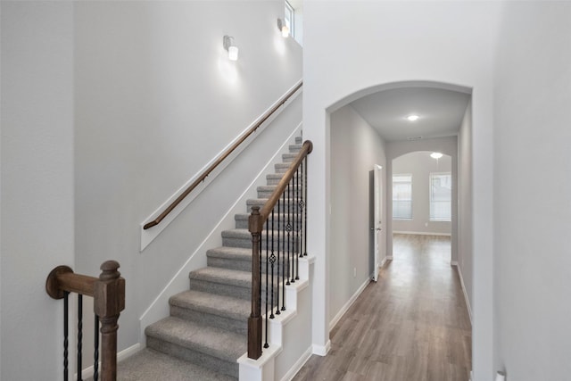 stairway with hardwood / wood-style flooring