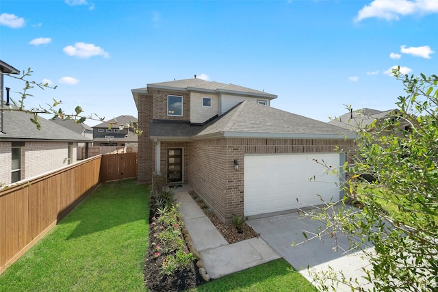 view of front of home with a garage and a front yard