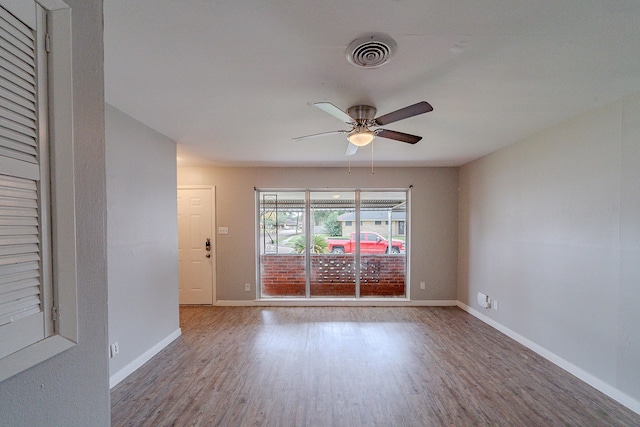 empty room featuring ceiling fan and hardwood / wood-style flooring