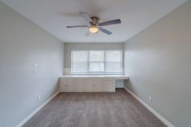 interior space featuring ceiling fan and light carpet