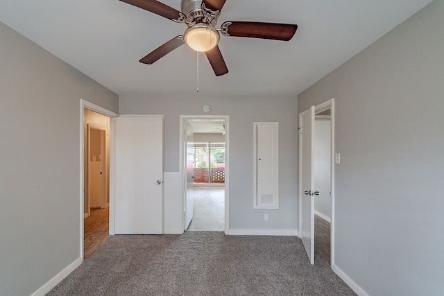 unfurnished bedroom featuring carpet flooring and ceiling fan