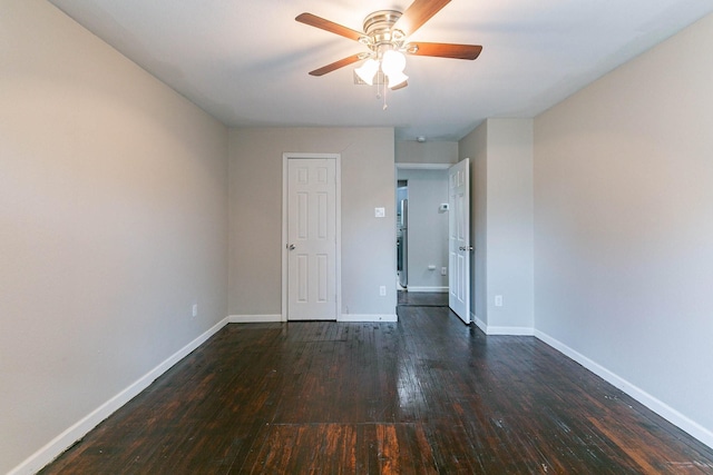 spare room featuring ceiling fan and dark hardwood / wood-style floors