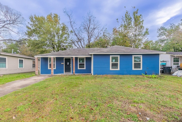 ranch-style home with a front yard