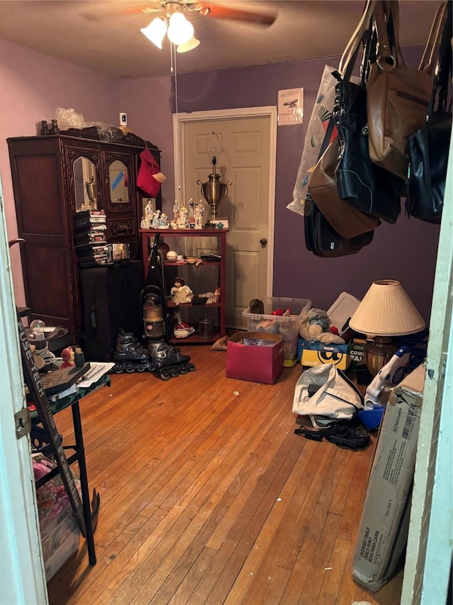 miscellaneous room featuring light hardwood / wood-style flooring and ceiling fan