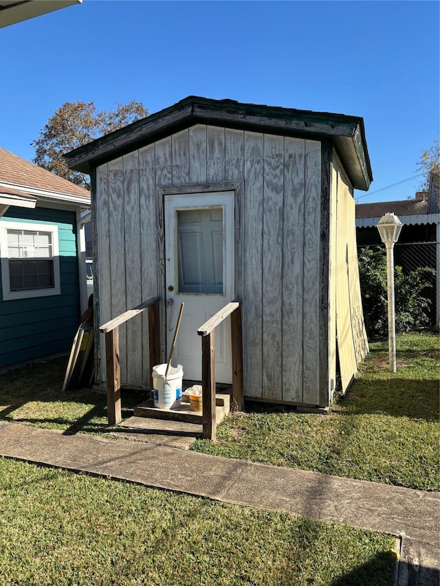 view of outdoor structure with a lawn