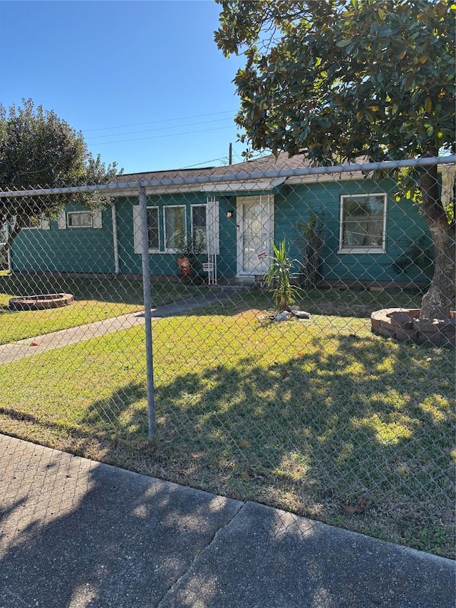 ranch-style house with a front lawn