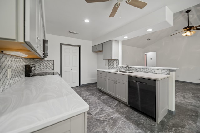 kitchen featuring appliances with stainless steel finishes, backsplash, vaulted ceiling, sink, and gray cabinets