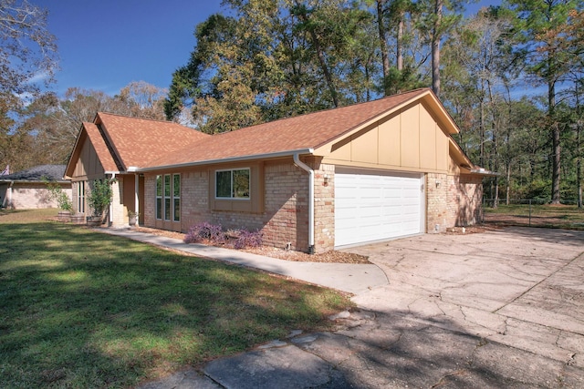 view of property exterior with a lawn and a garage