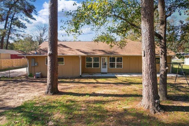 rear view of property featuring central air condition unit