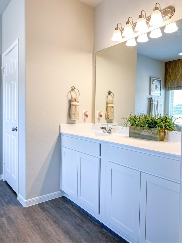 bathroom featuring hardwood / wood-style floors and vanity