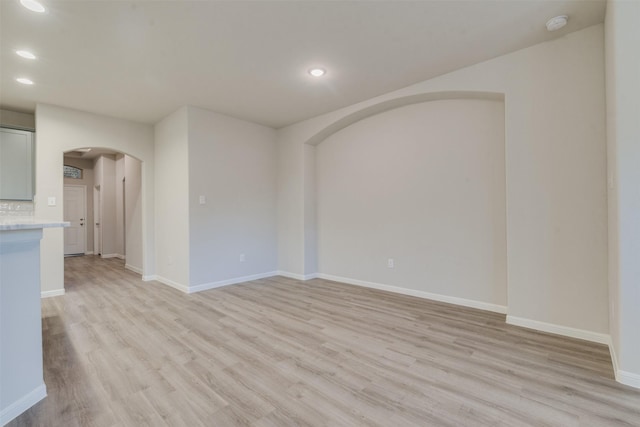 unfurnished room with light wood-type flooring