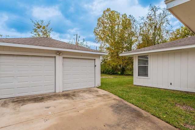 garage with a lawn