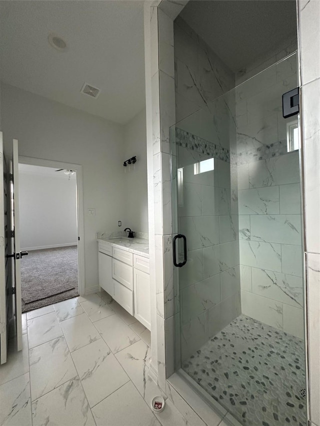 bathroom featuring vanity and walk in shower