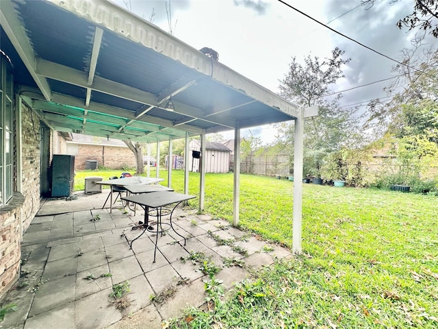 view of patio with a storage shed