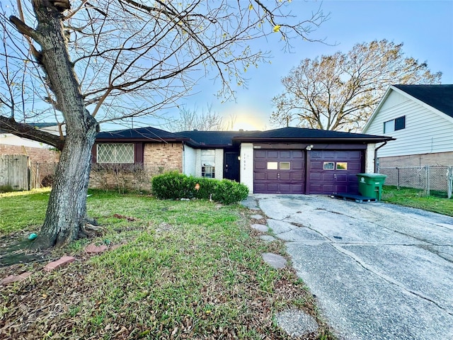 view of front of house with a garage and a front yard