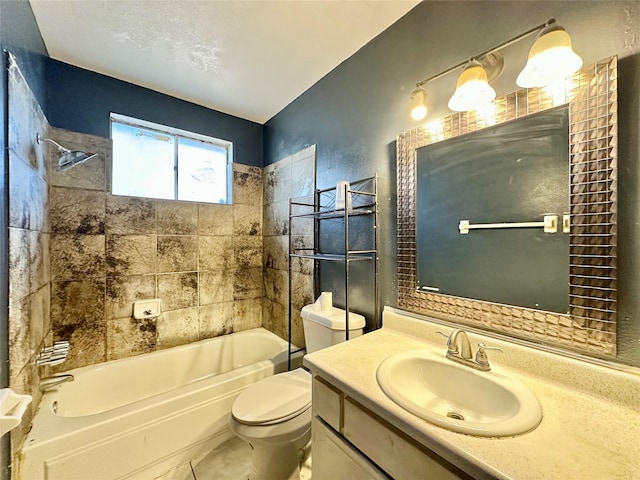 full bathroom with tile patterned flooring, tiled shower / bath combo, toilet, and vanity