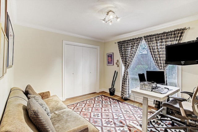 office space with wood-type flooring and ornamental molding