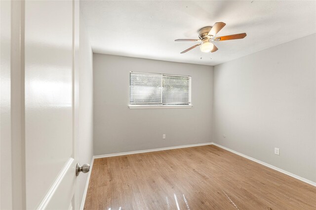 unfurnished room with light wood-type flooring and ceiling fan