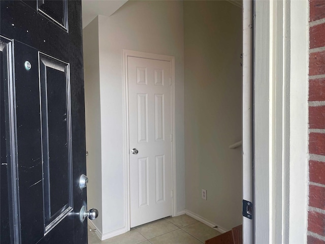 foyer entrance with light tile patterned floors