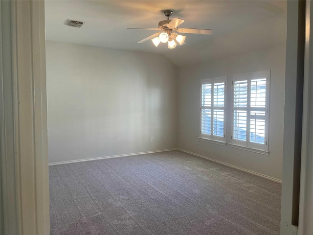 carpeted spare room with ceiling fan and lofted ceiling