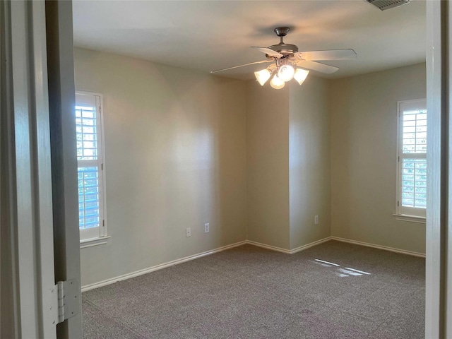 carpeted empty room featuring ceiling fan