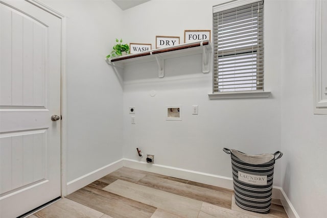 washroom with laundry area, light wood finished floors, hookup for a gas dryer, hookup for a washing machine, and hookup for an electric dryer