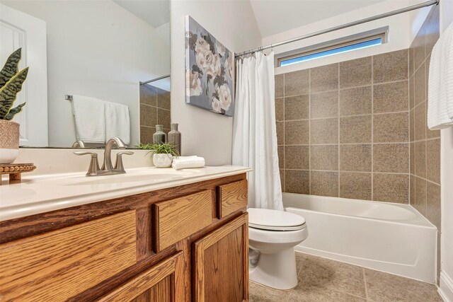 full bath featuring toilet, tile patterned floors, shower / bath combo, and vanity