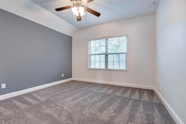 spare room with carpet floors, ceiling fan, baseboards, and lofted ceiling