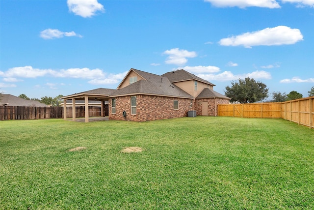 exterior space with a fenced backyard and cooling unit