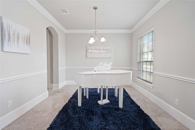 carpeted dining room with ornamental molding and an inviting chandelier