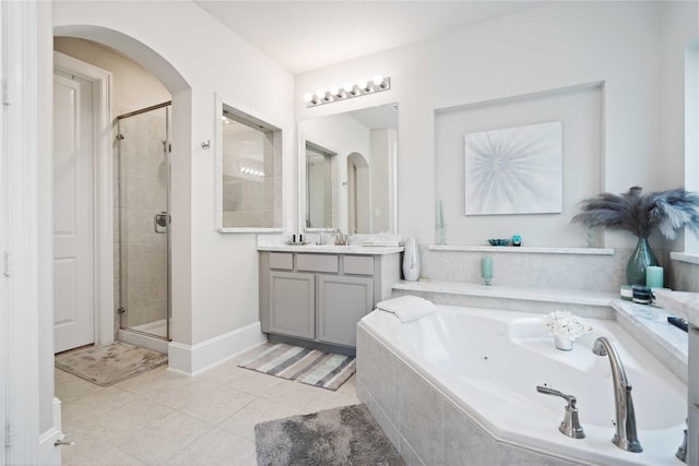 bathroom featuring vanity, tile patterned floors, and independent shower and bath