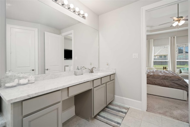 bathroom featuring tile patterned flooring, vanity, and ceiling fan