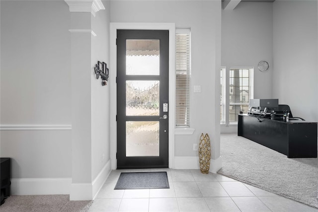 entrance foyer with light tile patterned floors and plenty of natural light