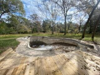 view of swimming pool with a wooden deck