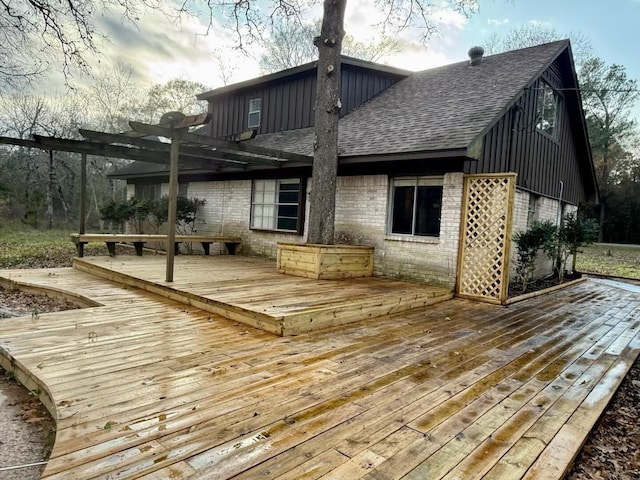 wooden deck featuring a pergola