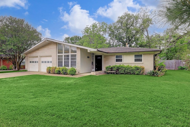 ranch-style home featuring a front lawn and a garage