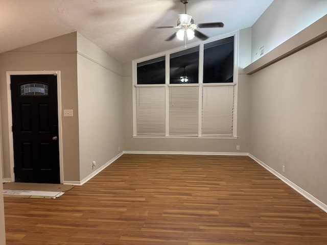 entrance foyer featuring ceiling fan, lofted ceiling, and wood-type flooring