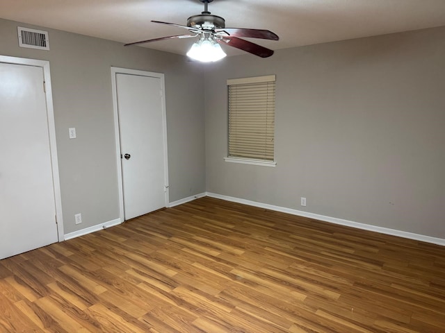 unfurnished bedroom with ceiling fan and light hardwood / wood-style floors