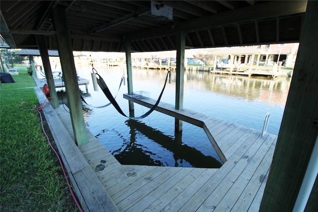 view of dock with a water view