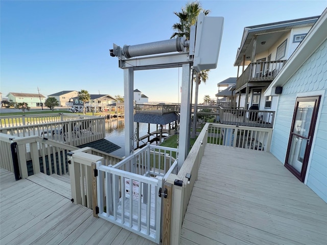 deck featuring a boat dock and a water view