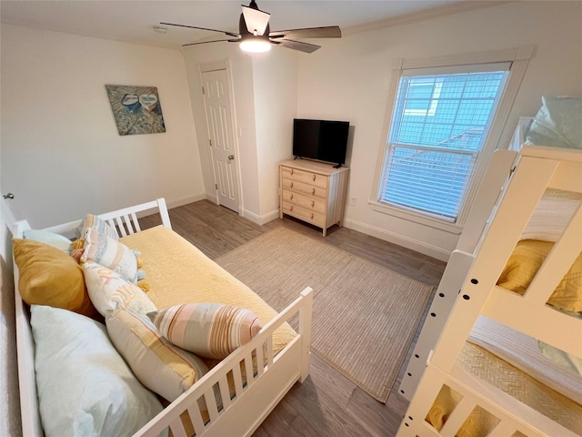 living room featuring wood-type flooring and ceiling fan