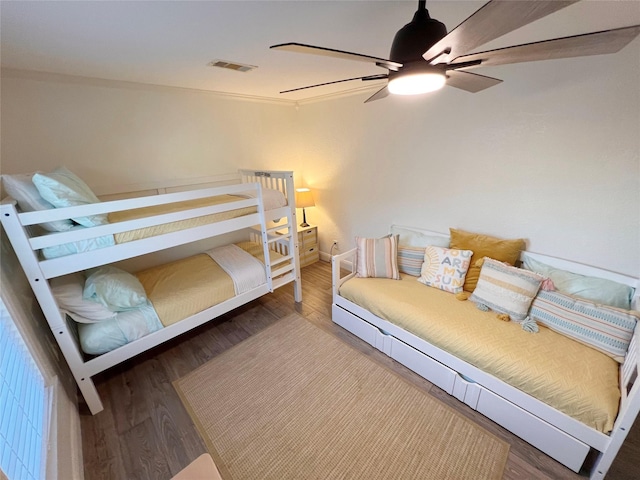 bedroom featuring hardwood / wood-style floors and ceiling fan